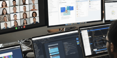 remote team collaborating through digital workspace tools on multiple screens