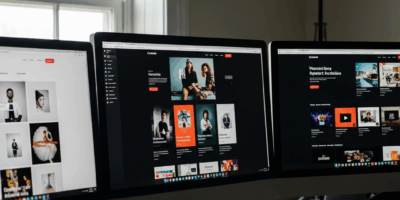 split screen comparison of three portfolio website designs on monitors